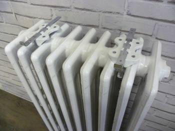 Supports MAXI N pour tablette installés sur radiateur fonte